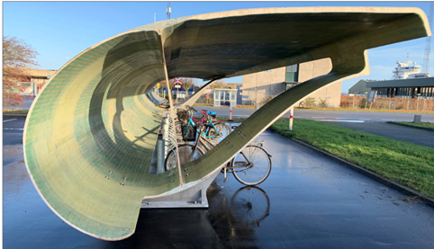 Blade repurposing: Bike shed in Aalborg, Denmark. Courtesy of Accelerating Wind Turbine Blade Circularity - 2020