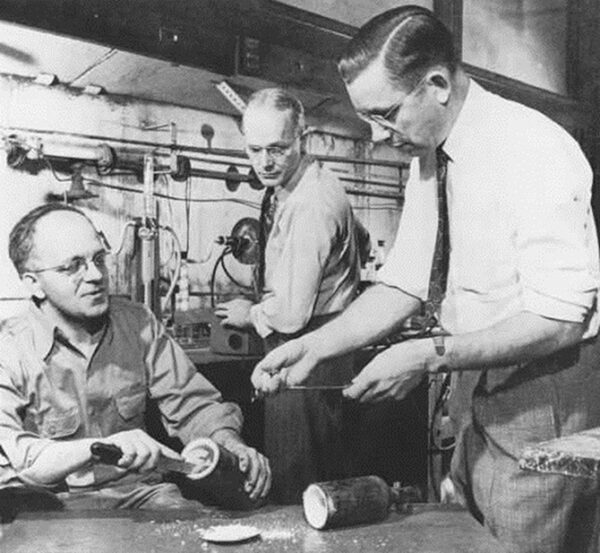 Reenactment of the 1938 discovery of PTFE. Left to right: Jack Rebok, Robert McHarness, and Roy Plunkett.